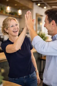 High-five-in-the-coffee-shop-200x300 - Triumph Business Solutions - Triumph Business Solutions Happy client website build